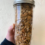 Homemade protein granola in a glass jar.