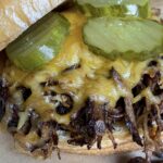 pulled pork sandwich with pickles